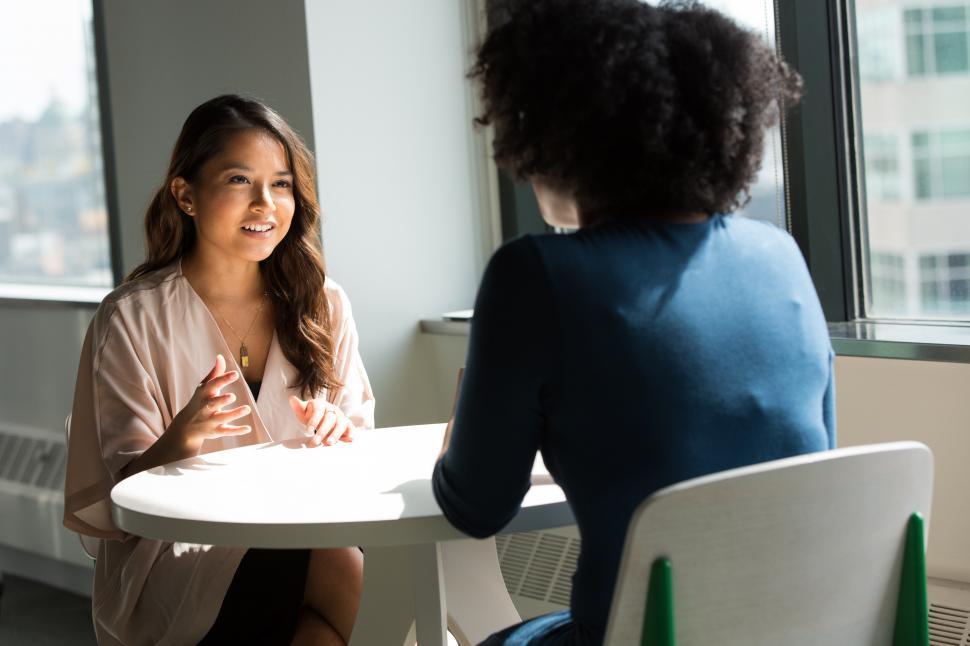 two-business-women-having-a-conversation